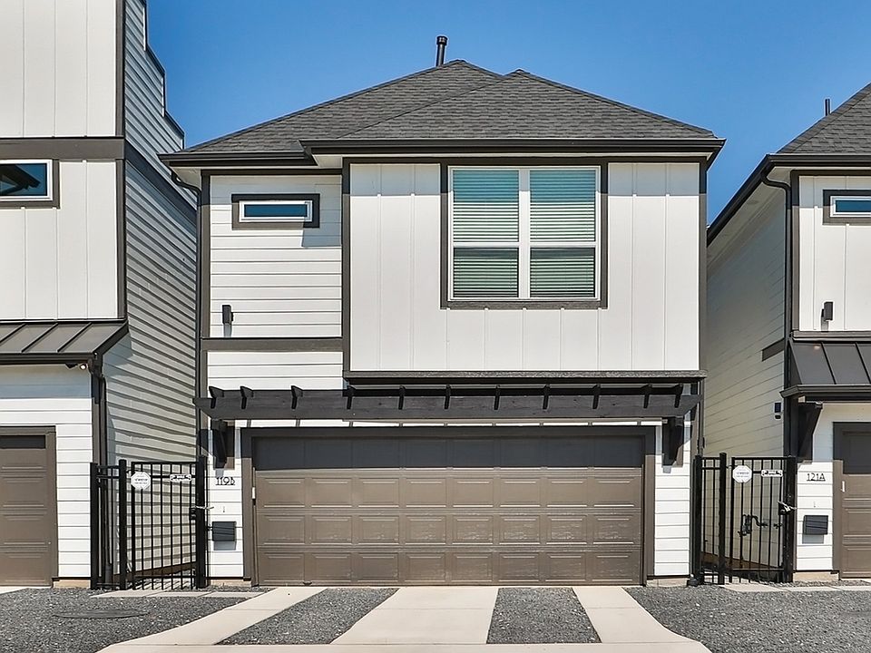 Experience sleek design with crisp white siding and sophisticated dark trim in vibrant Independence