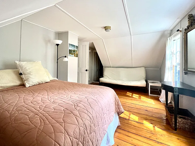 Bedroom with queen, futon and a single in large closet area