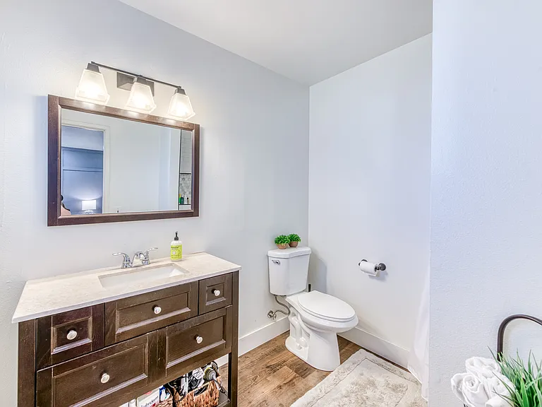 This en suite bathroom features a newly tiled/renovated shower.