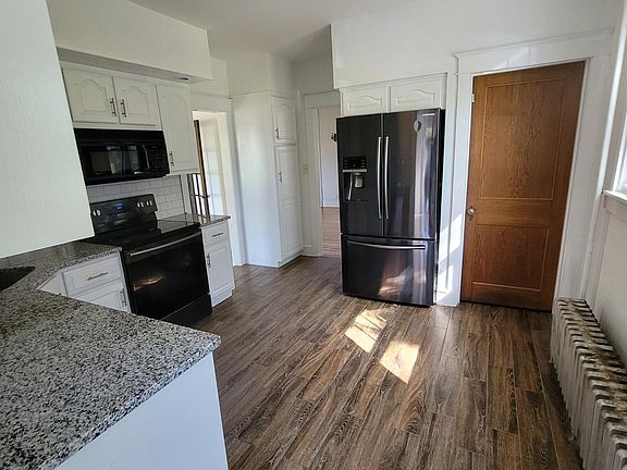 New granite countertops, new sink, new faucet, refinished cabinets, Samsung appliances