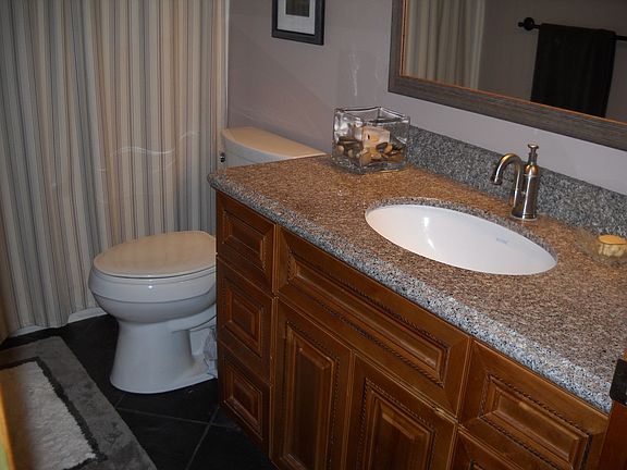 Gorgeous remodeled bath with granite counter, new fixtures
