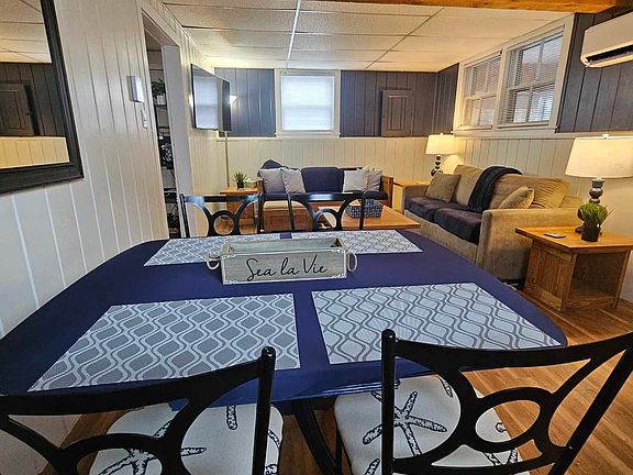Open concept living area with table for 4.