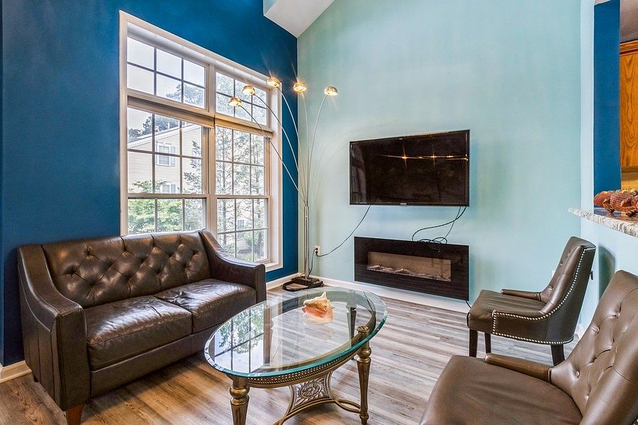 Living Room with tv and fireplace included.