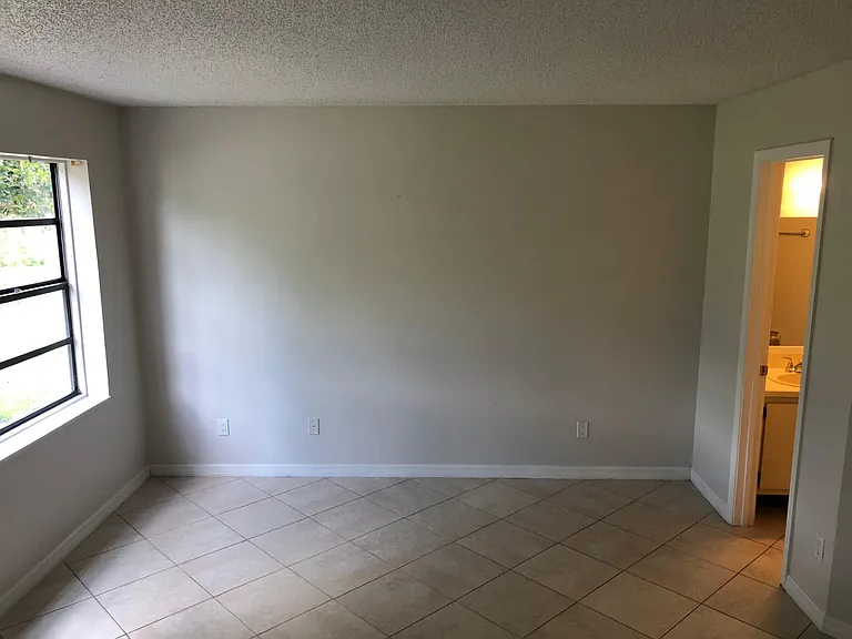 Master bedroom with bathroom with tub