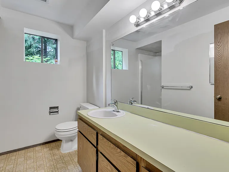 This bath with shower is located in the lower level.