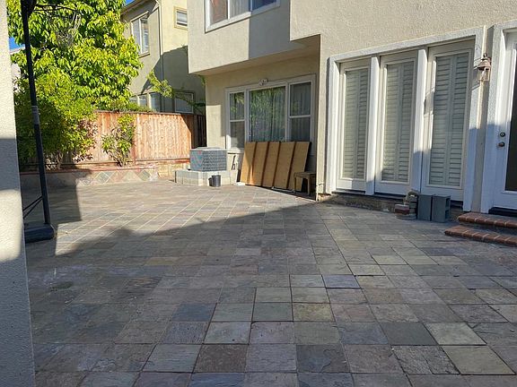 Backyard with tiles and zero maintenance