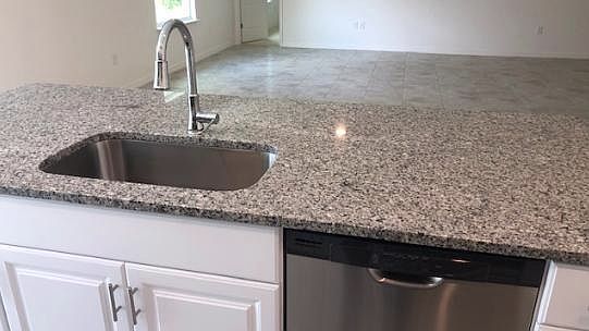 Deep kitchen sink in a large island overlooking the great ro