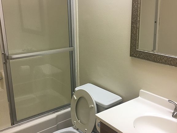 Full bath in upstairs hall that services second bedroom