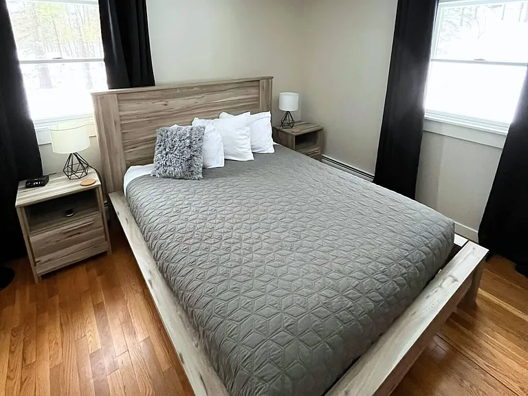 Main floor bedroom shown with queen bed.