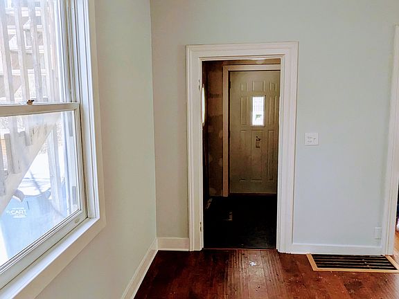 Entryway living area. New hardwood flooring