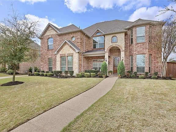 Several mature trees and an impeccably maintained yard add to the curb appeal of this executive home!