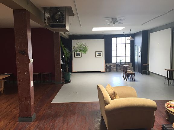 View towards front entrance from liunge area at back of buil