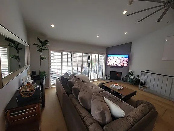 spacious grand room / living room w/ stucco fireplace