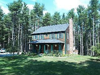 Mint 10 year old custom Colonial is surrounded by a recreational forest
