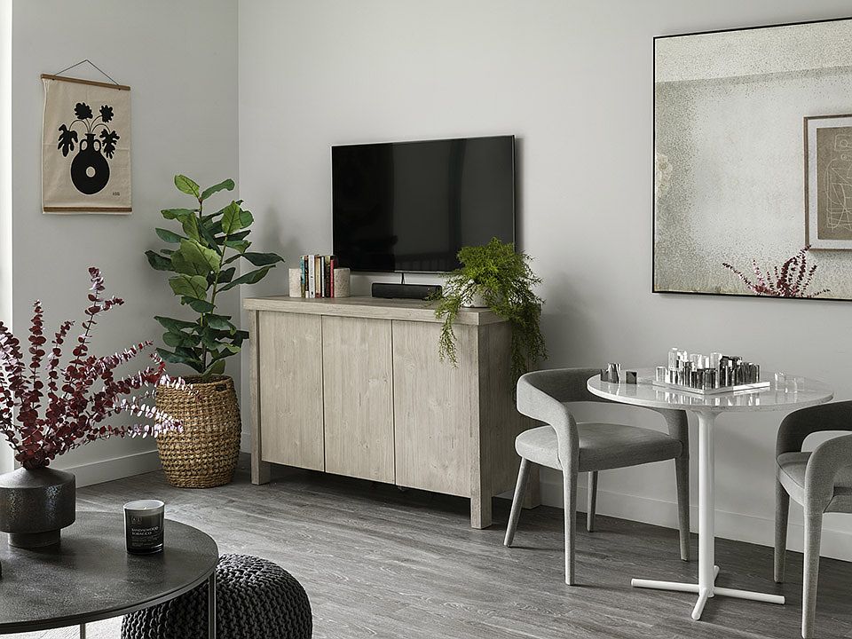Apartment Living and Dining area with wood floors.