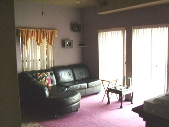 living room with sliding doors to enclosed porch