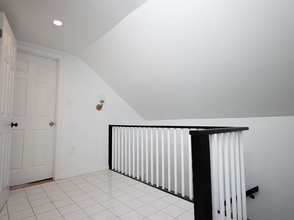 Second floor with small loft space that can fit desk, treadmill or Peleton.