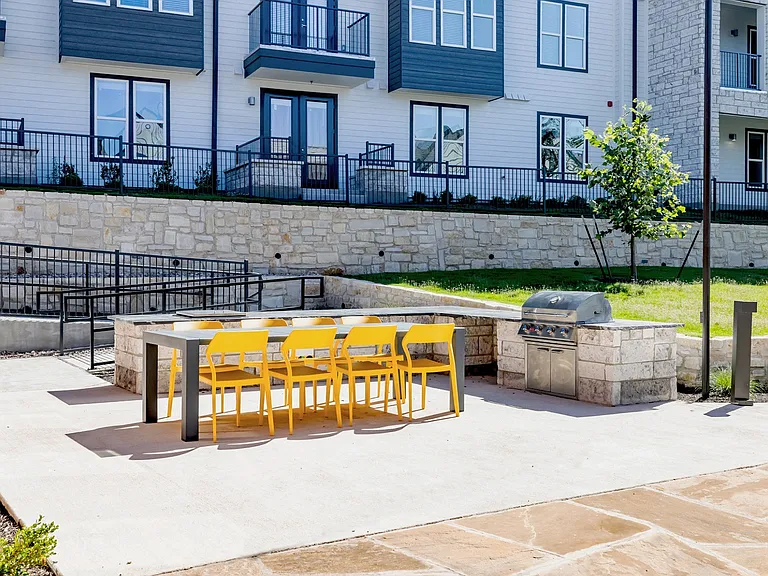 Outdoor entertainment space outfitted with grilling stations.