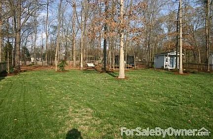 Large Fenced Back yard
						:
						Large, shaded with hard wood trees