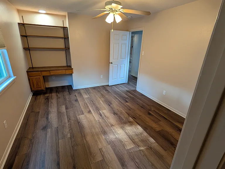 The Middle Bedroom's built in desk is the perfect place to start those straight-A report cards at one of the two schools within walking distance. And the walk-in closet is a sizable 6' x 4'. The 14x11' room has a room-darkening cellular shade.