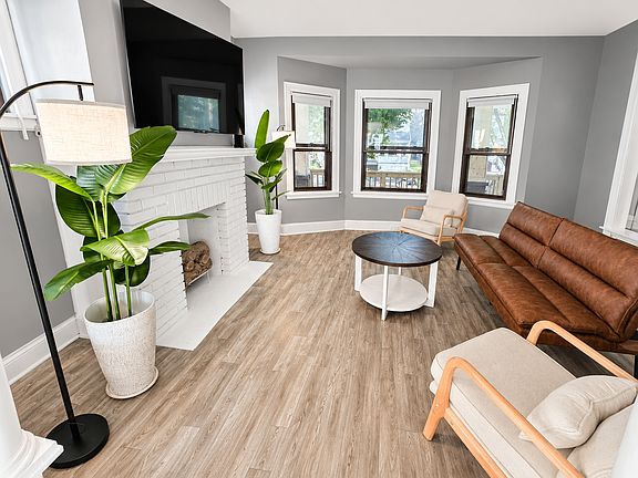 Bright living room with open layout and updated flooring