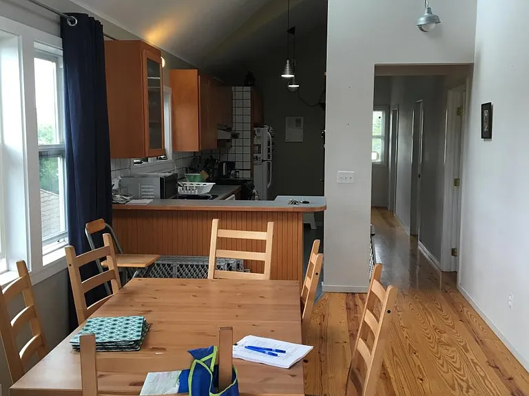 Dining room looking into kitchen and down hall