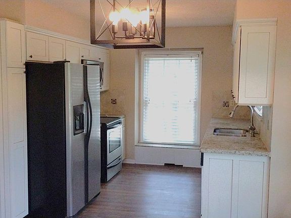 view of kitchen that has two windows