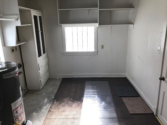 Utility room with washer and dryer hookups.