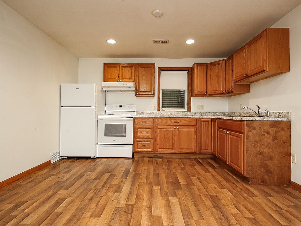 Update kitchen with new countertops, oven and refrigerator.