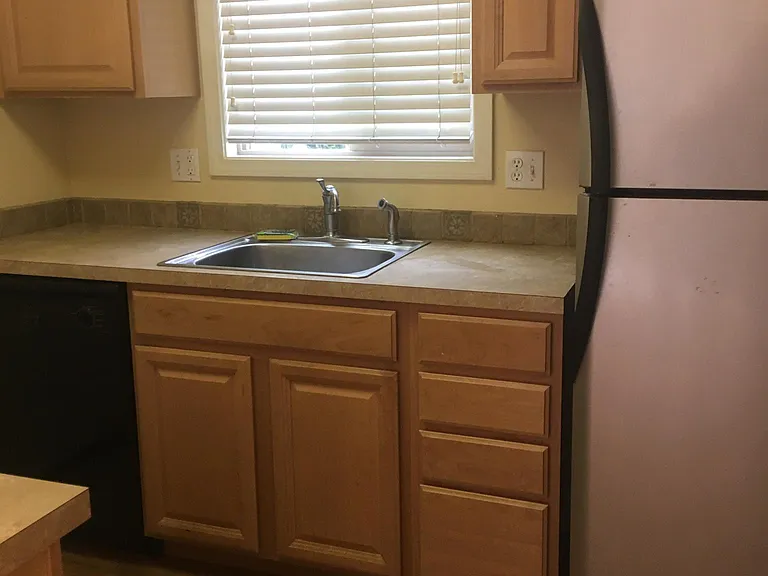 Kitchen with newer cabinets and stainless steel appliances.