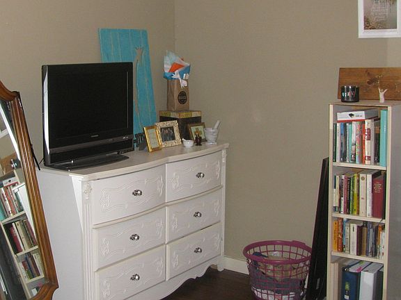 Seating space used by a previous tenant for dressing area and storage.