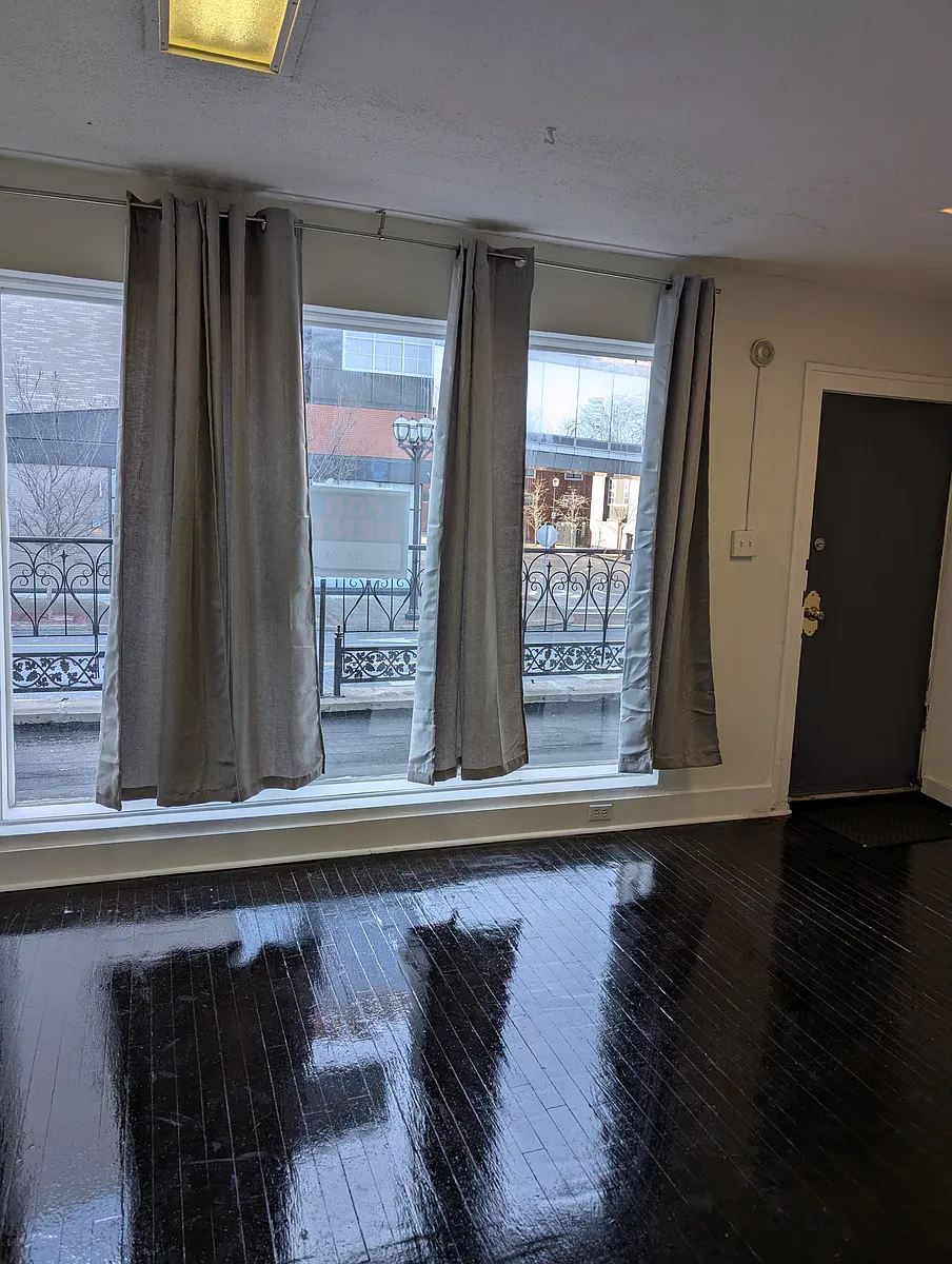 Front Entrance and Living Area with Balcony and Large Front Window for Light - 7529 Forsyth Blvd #B