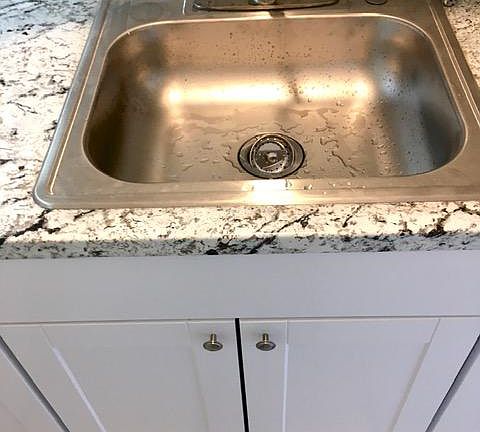 Brand new sink with single pull faucet in brushed nickel
