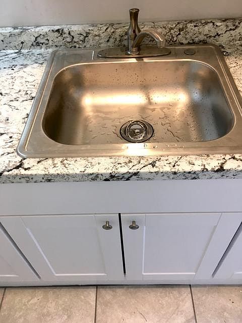 Brand new sink with single pull faucet in brushed nickel