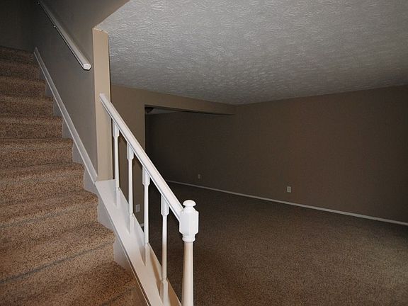 Livingroom w/ Stairs Leading to the Second Floor