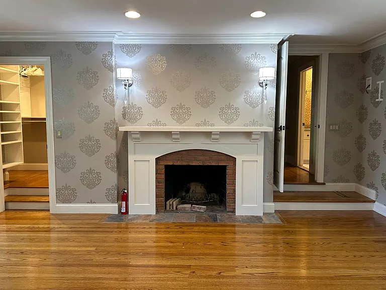 Upstairs fireplace in bedroom 1.
