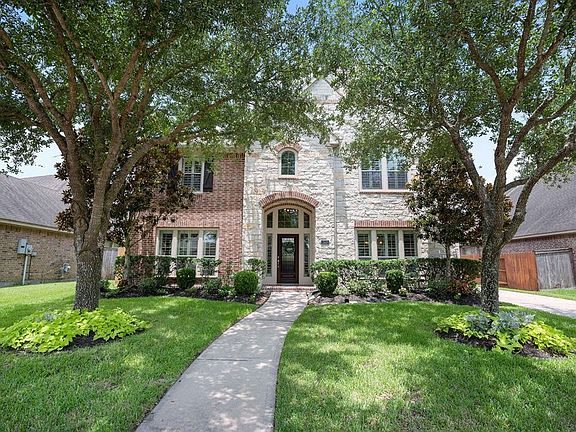 Great curb appeal with professionally landscaped front yard.