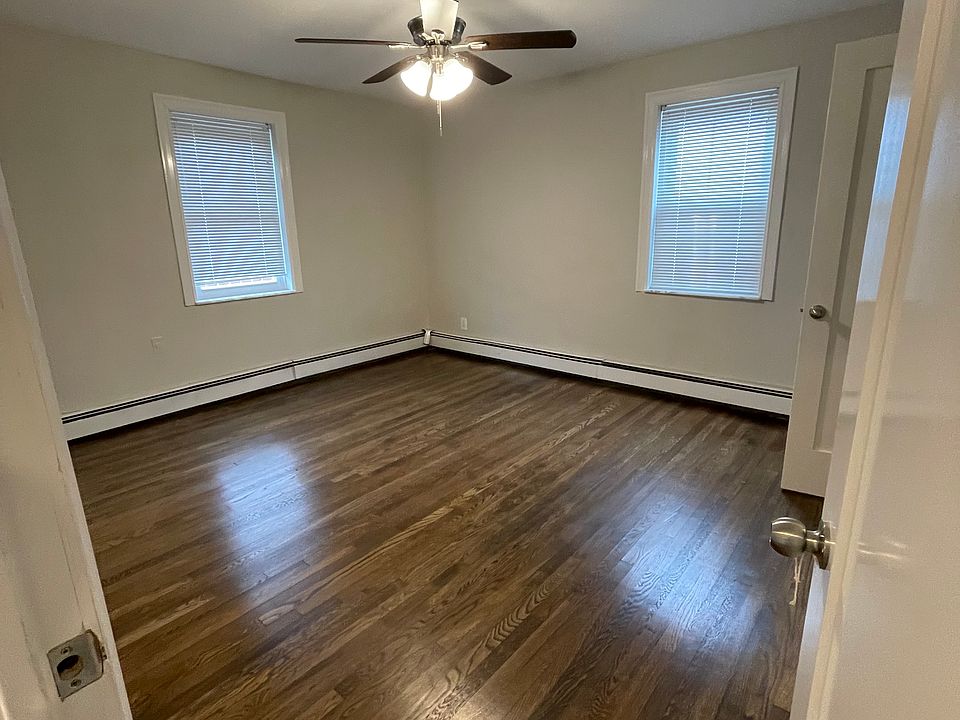 back Bedroom can fit king sized bed with large closet 2 windows lots of natural sunlight
