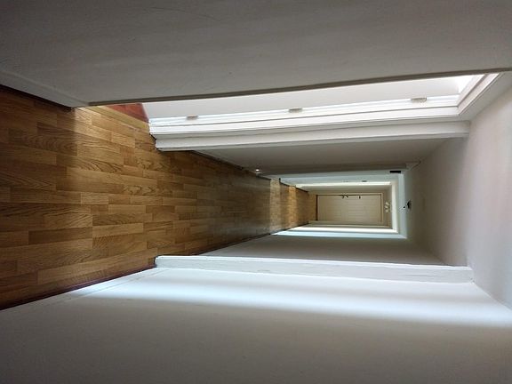 Long coridor in e each unit. 1190 square feet total.