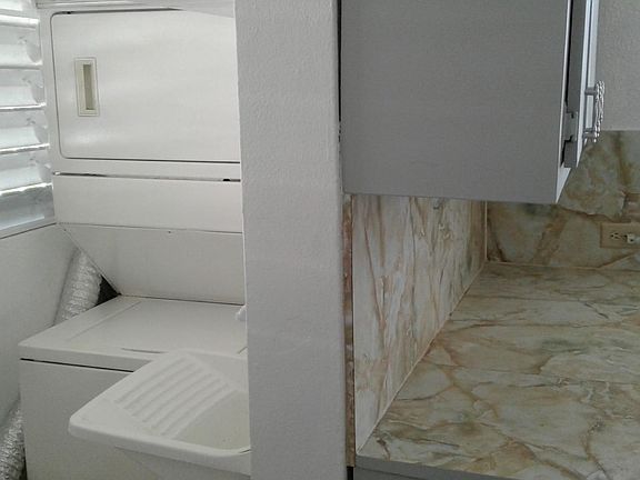 Laundry Center. Wash/Dry Combo. Sink with Faucet