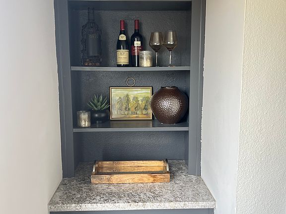 Charming built-in that can be used as a bar area or library.