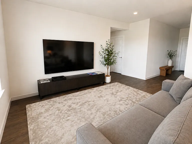 Living room with 85 inch tv included.