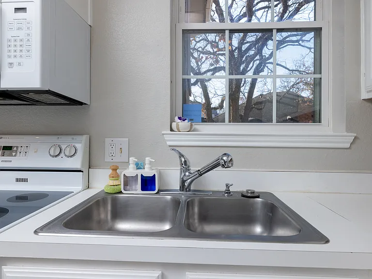 Fully stocked kitchen with ample counter space, stainless steel appliances, toaster, and kettle_everything you need to cook, snack, or sip in comfort.