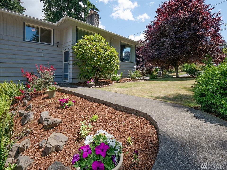Massive, efficient layout on gorgeous corner lot with large yard & easy-care garden just in time to enjoy the summer color!