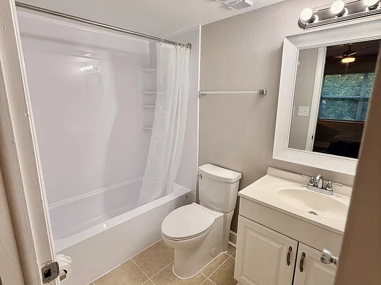 Updated bathroom with shower/tub combo and shortage under the single vanity.