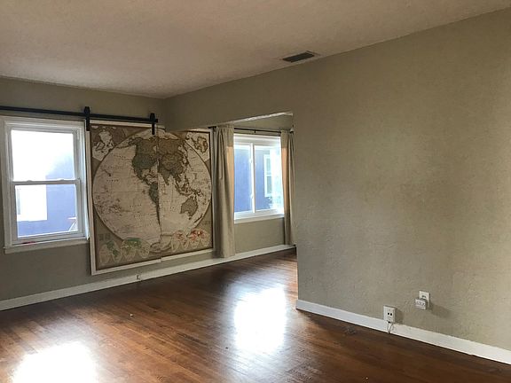 Main living room area - world map on wall moves across to act as window shade