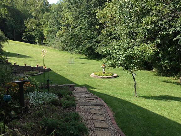 Walkway to back by garden