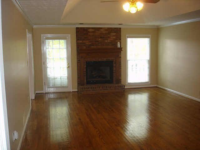 Huge Family Room with fireplace and gorgeous hardwood floors