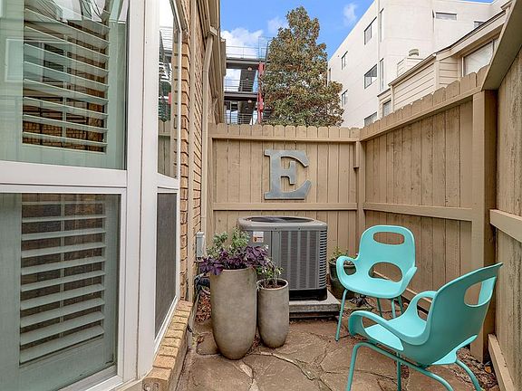 Private fenced in courtyard at front of home perfect for grilling and relaxing.