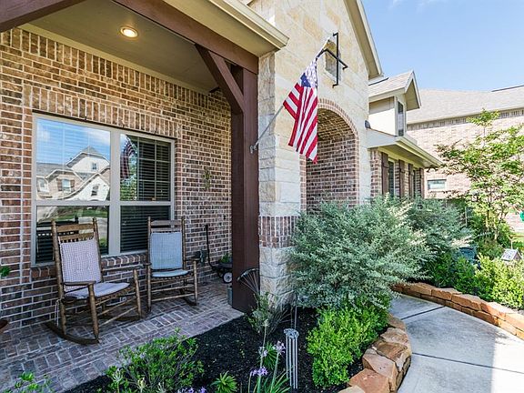 Front elevation also features spacious front porch.